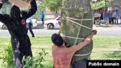 The Amnesty statement included an image used in Iranian news coverage of the incident, showing a young man tied to a tree as he was being flogged by a masked man. The rights watchdog said it could not independently verify whether it was a photo of the actual flogging in question.