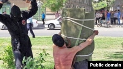 Iran -- a man being flogged for drinking alcohol. Date Unknown. 