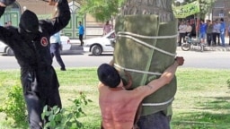 The Amnesty statement included an image used in Iranian news coverage of the incident, showing a young man tied to a tree as he was being flogged by a masked man. The rights watchdog said it could not independently verify whether it was a photo of the actual flogging in question.