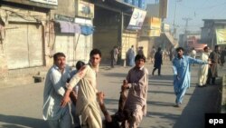 PAKISTAN SUICIDE BOMB BLAST -- GRAPHIC CONTENT -- People carry a victim who was injured in a suicide bomb blast at Toori market in Parachinar, Pakistan, 23 June 2017.