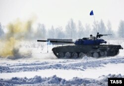 A Russian Army tank fires during a live-fire training exercise in the Kahabarovsk region on March 3.