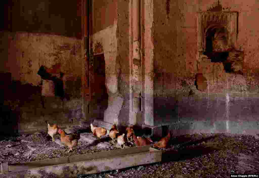 The interior of Kizil Kilise church. The ancient structure is currently used to house chickens. The cross above the entrance to the church has been chipped away.