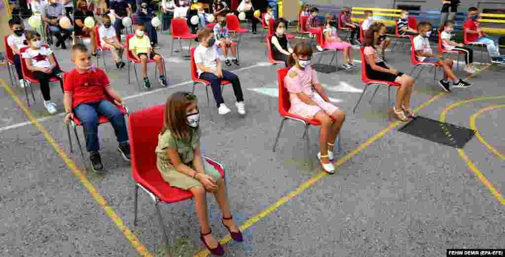 Elementary school students wearing face masks keep their social distance on the first day of school in Sarajevo on September 1.