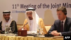 Saudi Energy Minister Khalid al-Falih (C), Russian Energy Minister Alexander Novak (R), and UAE's Energy Minister Suhail Mohammed Faraj al-Mazroui (L) attend during a meeting of their Joint Ministerial Monitoring Committee in the Emirati capital Abu Dhab
