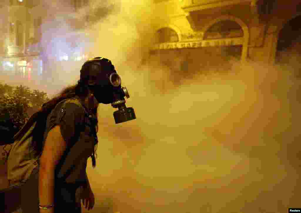 A protestor wears a gas mask during clashes with police near Taksim Square in Istanbul on the night of June 22-23. (Reuters/Marko Djurica)