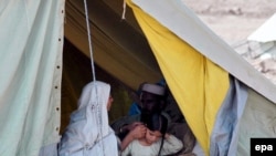 A family, displaced from Bajaur, in temporary shelter on the outskirts of Peshawar