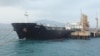 An Iranian oil tanker is anchored at a dock near Puerto Cabello, Venezuela on May 25. The United States has justified a new round of sanctions against actors in Iran's oil sector, saying revenue from oil sales supports the Quds Force.