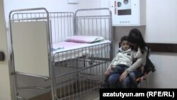 Armenia -- A child suffering from a respiratory virus and his mother wait in the hallway of Arabkir hospital, 8Jan2016