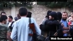 Сириядағы қазақ жиһадшылары деп жарияланған видеоның скриншоты. (Көрнекі сурет)