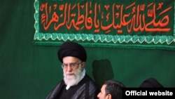 Iranian Supreme Leader Ali Khamenei (second from left) and President Mahmud Ahmadinejad (second from right) at a religious ceremony in May.