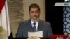 Egyptian President-elect Muhammad Morsi speaks during his first televised address to the nation in Cairo on June 24.