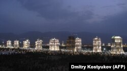 Turkmenistan -- A row of white-marble apartment buildings lit-up at night in Ashgabat, 05Jul2008