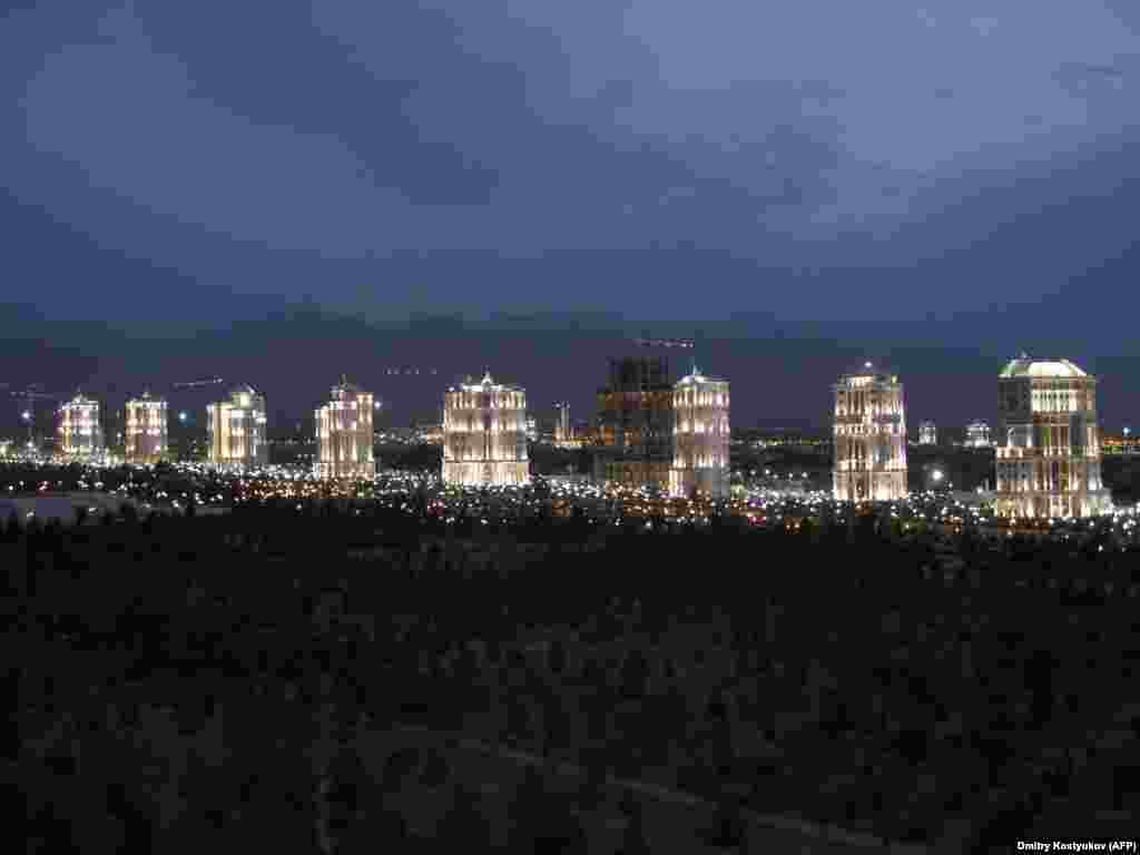 A row of white-marble apartment buildings