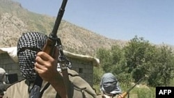 Kurdistan Workers Party (PKK) fighters patrol near the Iran-Iraq and Turkish borders.