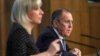 Russian Foreign Minister Sergei Lavrov, accompanied by Russian Foreign Ministry spokeswoman Maria Zakharova, answers reporters' questions in Moscow on January 15.