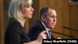 Russian Foreign Minister Sergei Lavrov, accompanied by Russian Foreign Ministry spokeswoman Maria Zakharova, answers reporters' questions in Moscow on January 15.