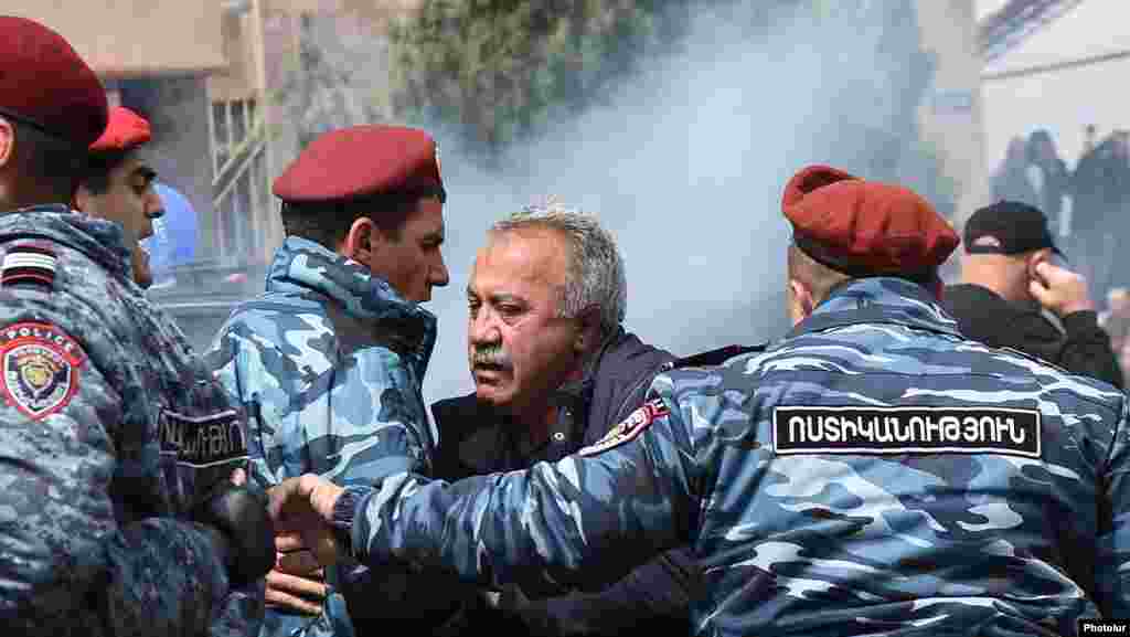 Police detain opposition parliament member Sasun Mikaelyan during an antigovernment rally in Yerevan.