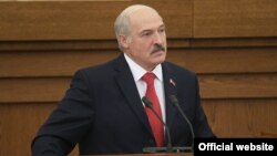 Belarusian President Alyaksandr Lukashenka addresses a session of parliament in Minsk on October 7.