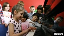 Children play music at an orphanage in the southern Russian city of Rostov-on-Donu. (file photo)