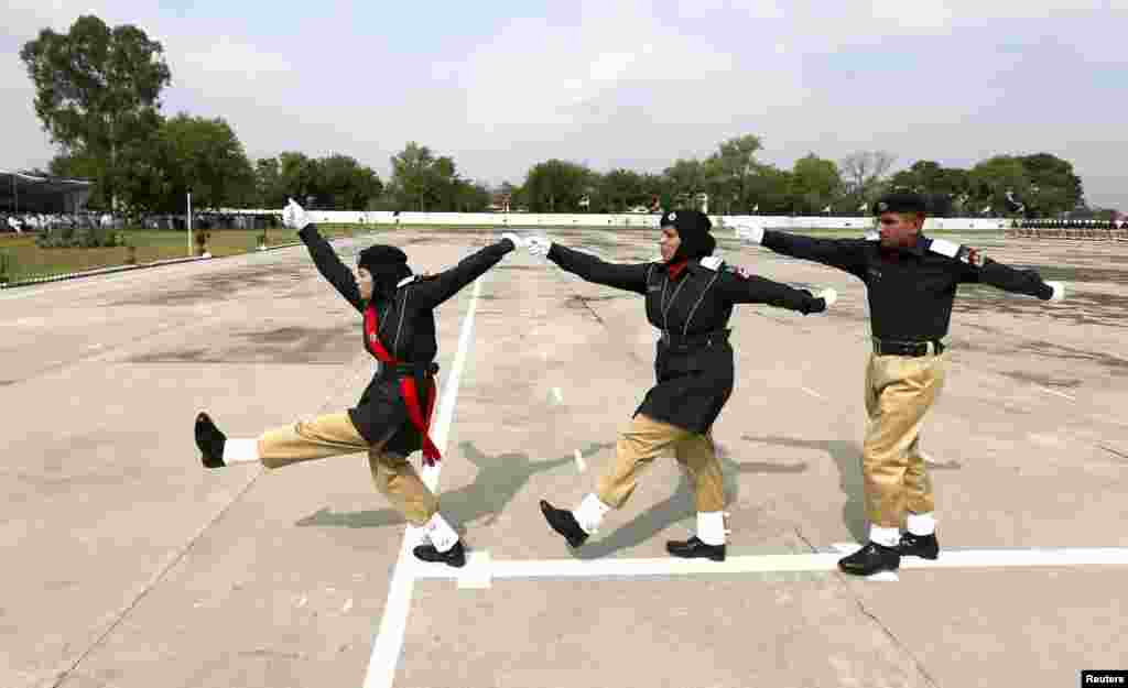 Pakistani police academy graduates march during their graduation ceremony in Islamabad. Out of the 408 graduating officers, 76 female officers were inducted into the Pakistan police force. (Reuters/Caren Firouz)