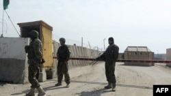 Afghan National Army soldiers stand guard outside Bagram prison, about 50 kilometers north of Kabul, on February 13.