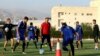 Iran's national football team Head Coach Carlos Queiroz, center, conducts a training session a day ahead of a Group A match against Syria during the 2018 FIFA World Cup Russia Qualifier in Tehran, Iran, Monday, Sept. 4, 2017. Millions of Syrians may final