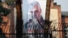 A picture of Qassem Soleimani, head of the elite Qods Force, who was killed in an air strike, is seen on the former U.S. Embassy's building in Tehran, January 7, 2020