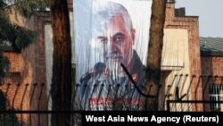 A picture of Qassem Soleimani, head of the elite Qods Force, who was killed in an air strike, is seen on the former U.S. Embassy's building in Tehran, January 7, 2020