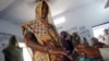 Women cast their votes at a polling station in Uttar Pradesh.