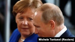 German Chancellor Angela Merkel (left), in talks with Russian President Vladimir Putin in January 2020, will retire from politics after elections next month.