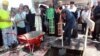 Russian businessman Sergei Samsonenko (holding shovel) helps lay the cornerstone for the Holy Trinity Russian Orthodox church in Skopje. 