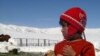 A child in Naryn is bundled up for unseasonable weather.