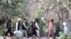 Newly freed AfghanTaliban prisoners walk inside the Pul-e-Charkhi prison in Kabul on August 13.