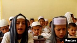 Afghan boys read the Koran at a madrasah or religious school in Kabul. (file photo)