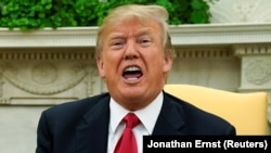 U.S. President Donald Trump speaks to the media at the White House in Washington on January 10, 2018