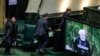 Officials carrying copies of Iran's next year budget in the parliament as President Hassan Rouahni makes his speech. December 8, 2019