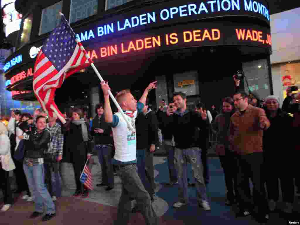 People react to the death of Osama bin Laden in Times Square in New York early on May 2.