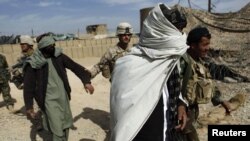 File photo of Afghan detainees in southern Helmand province.