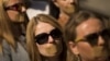 Journalists protest with taped mouths against censorship.