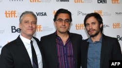 "Rosewater" film director Jon Stewart, Iranian subject Maziar Bahari, and Mexican actor Gael Garcia Bernal (left to right) pose at the Toronto film festival on September 8.