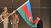 Azerbaijan -- President Ilham Aliyev kises national flag during his presidential inauguration in Baku, 24Oct2008
