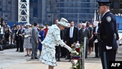 Queen Elizabeth II places a wreath at Ground Zero in New York City on July 6 to honor 9/11 victims.