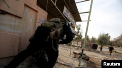 Iraqi Special Forces clash with Islamic State militants near Mosul University on January 13.