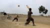 Afghan boys play cricket in Jalalabad.