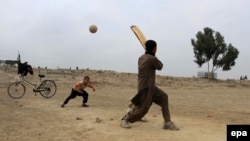 Afghan boys play cricket in Jalalabad.