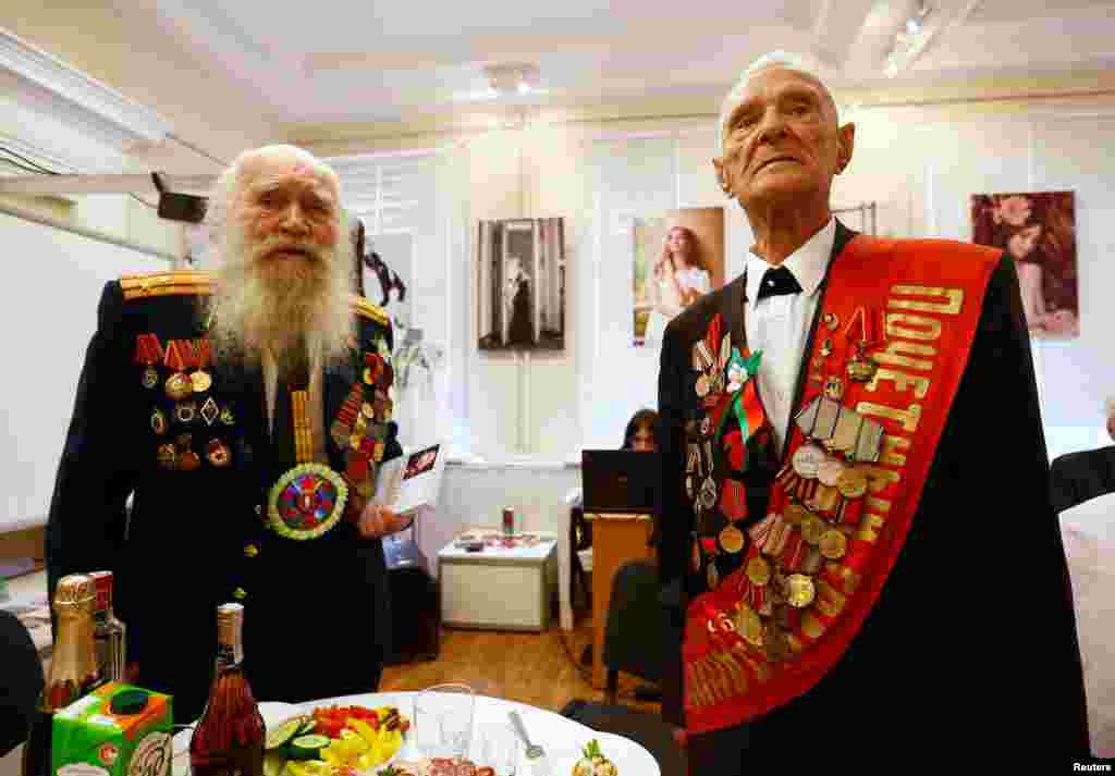 Belarusian World War II veterans Vasily Molodtsov (right) and Nikolay Skatulin pose for a photo during an event to mark the 71st anniversary of the country's liberation from Nazi Germany in Minsk. (Reuters/Vasily Fedosenko)