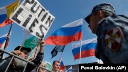 În timpul unui protest pentru alegeri libere și corecte la Moscova, 20 iulie 2019 