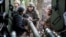 Військові 15 БрОП Нацгвардії України «Кара-Даг» розвантажують боєприпаси для реактивної установки «Град-П» («Партизан») поблизу прифронтового Добропілля на Донеччині, 25 вересня 2026 року 