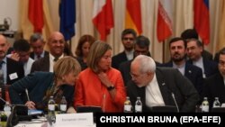 AUSTRIA -- EU-director Helga Schmid (L-R), Federica Mogherini, EU High Representative for Foreign Affairs and Security Policy, and Foreign Minister of Iran Mohammad Javad Zarif attend a ministerial meeting of the Joint Commission of the Joint Comprehensiv