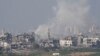 Smoke rises following an Israeli air strike in the Gaza Strip, as seen from southern Israel, on October 28.